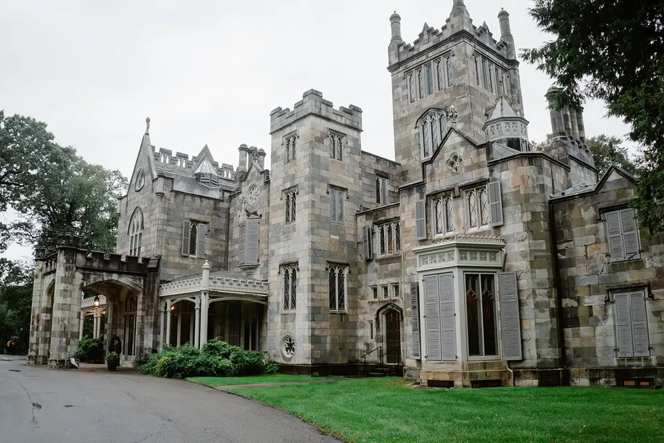 Lyndhurst mansion's grey stone towers and turrets above the lawn.